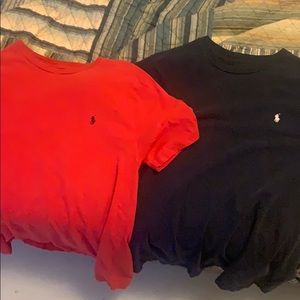 Two polo tee shirts. One red and one navy blue